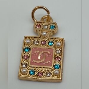 CHANEL Gold Perfume Bottle Charm Pink Enamel CC Crystals Karl Lagerfeld Era